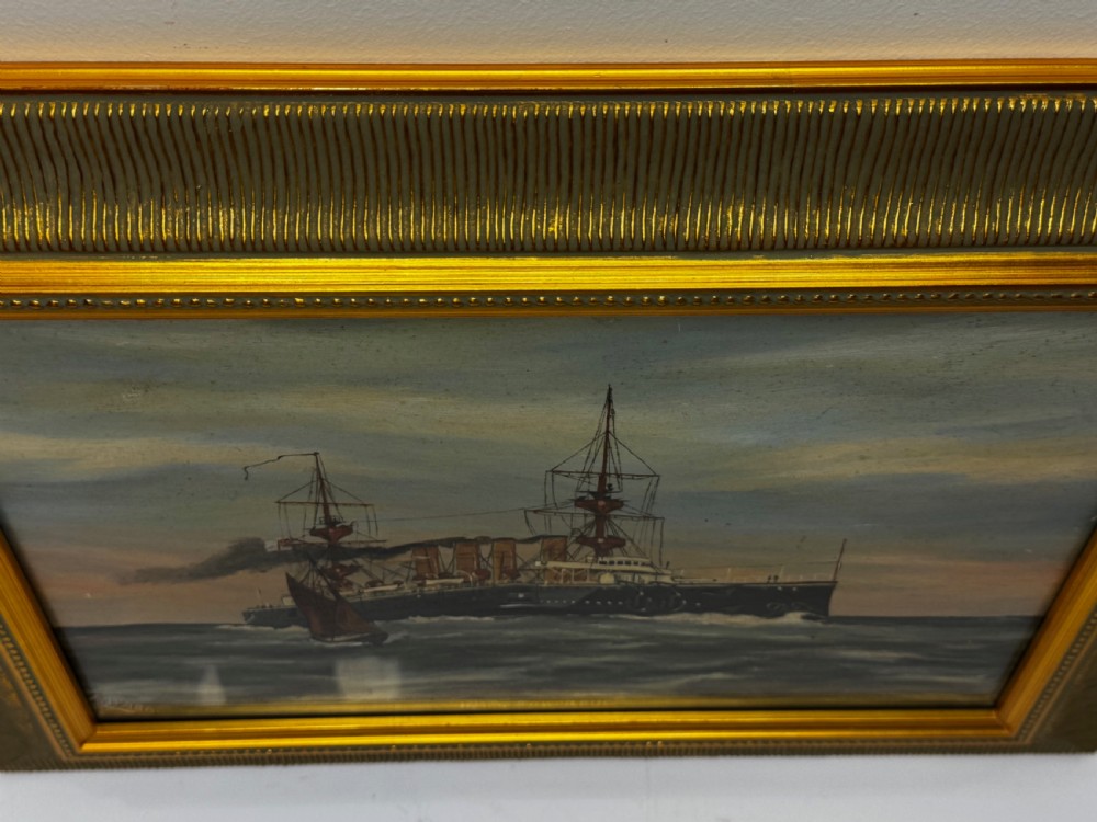 An oil painting depicting the Royal Navy cruiser HMS Powerful sailing across open waters with smoke billowing from its funnels under a sunset sky, housed in a gilt frame. View III