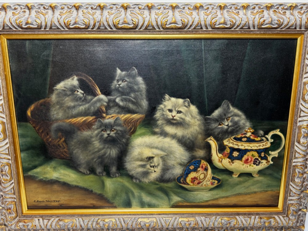 A framed oil painting featuring six fluffy grey and silver Persian kittens arranged around a woven basket and a decorated porcelain teapot. View XIV