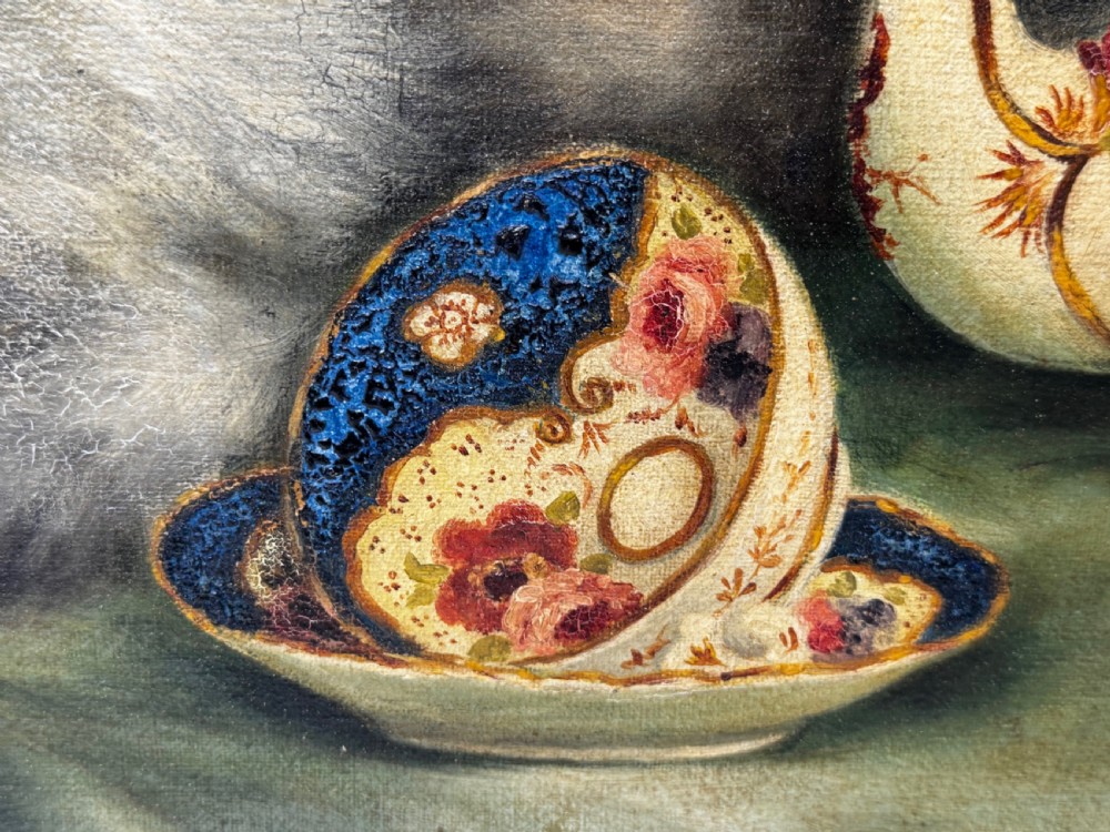 A framed oil painting featuring six fluffy grey and silver Persian kittens arranged around a woven basket and a decorated porcelain teapot. View XVII