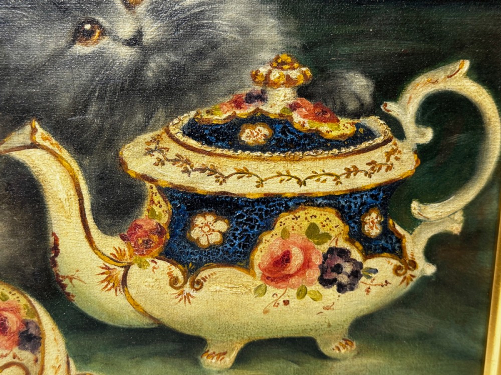 A framed oil painting featuring six fluffy grey and silver Persian kittens arranged around a woven basket and a decorated porcelain teapot. View XVIII