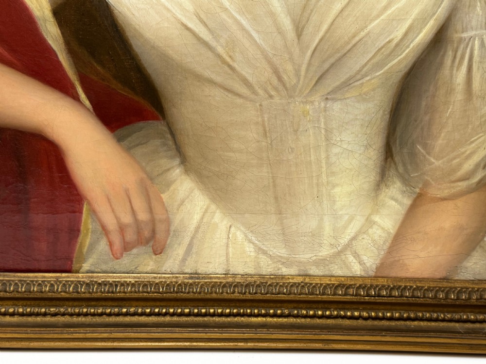 An antique Georgian oil portrait painting depicting a woman in a white off-the-shoulder gown with a red drape, framed in a beaded gold gilt frame. View IX