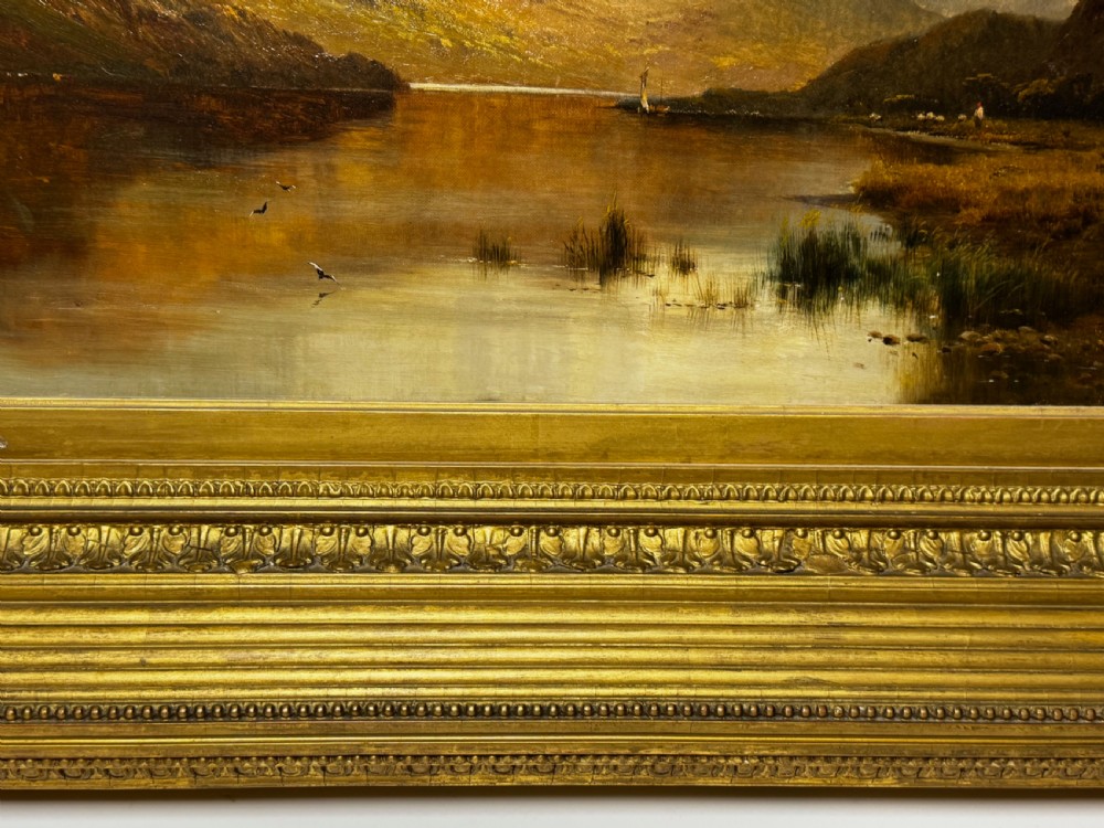 A Victorian landscape oil painting depicting Lake Windermere with mountains in the background, set within a heavy multi-moulded gold frame. View II