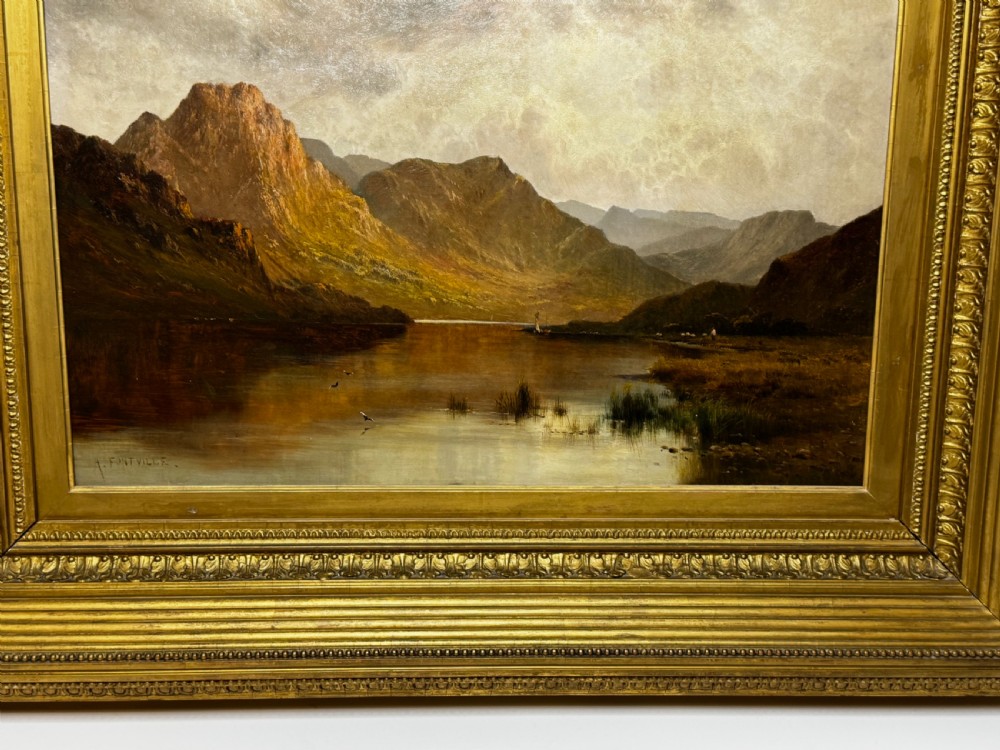A Victorian landscape oil painting depicting Lake Windermere with mountains in the background, set within a heavy multi-moulded gold frame. View III