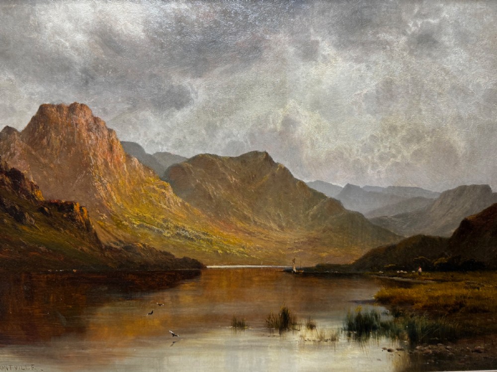 A Victorian landscape oil painting depicting Lake Windermere with mountains in the background, set within a heavy multi-moulded gold frame. View XIV