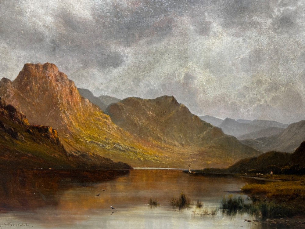 A Victorian landscape oil painting depicting Lake Windermere with mountains in the background, set within a heavy multi-moulded gold frame. View XV
