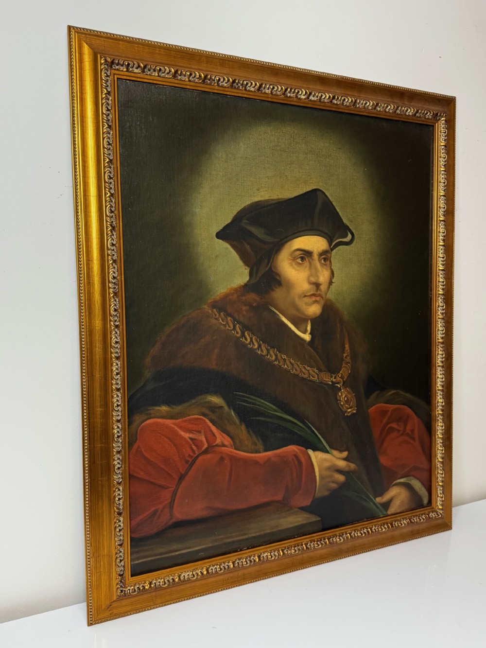 An oil portrait painting depicting Sir Thomas More framed in an ornate gold gilt wood frame. View IV