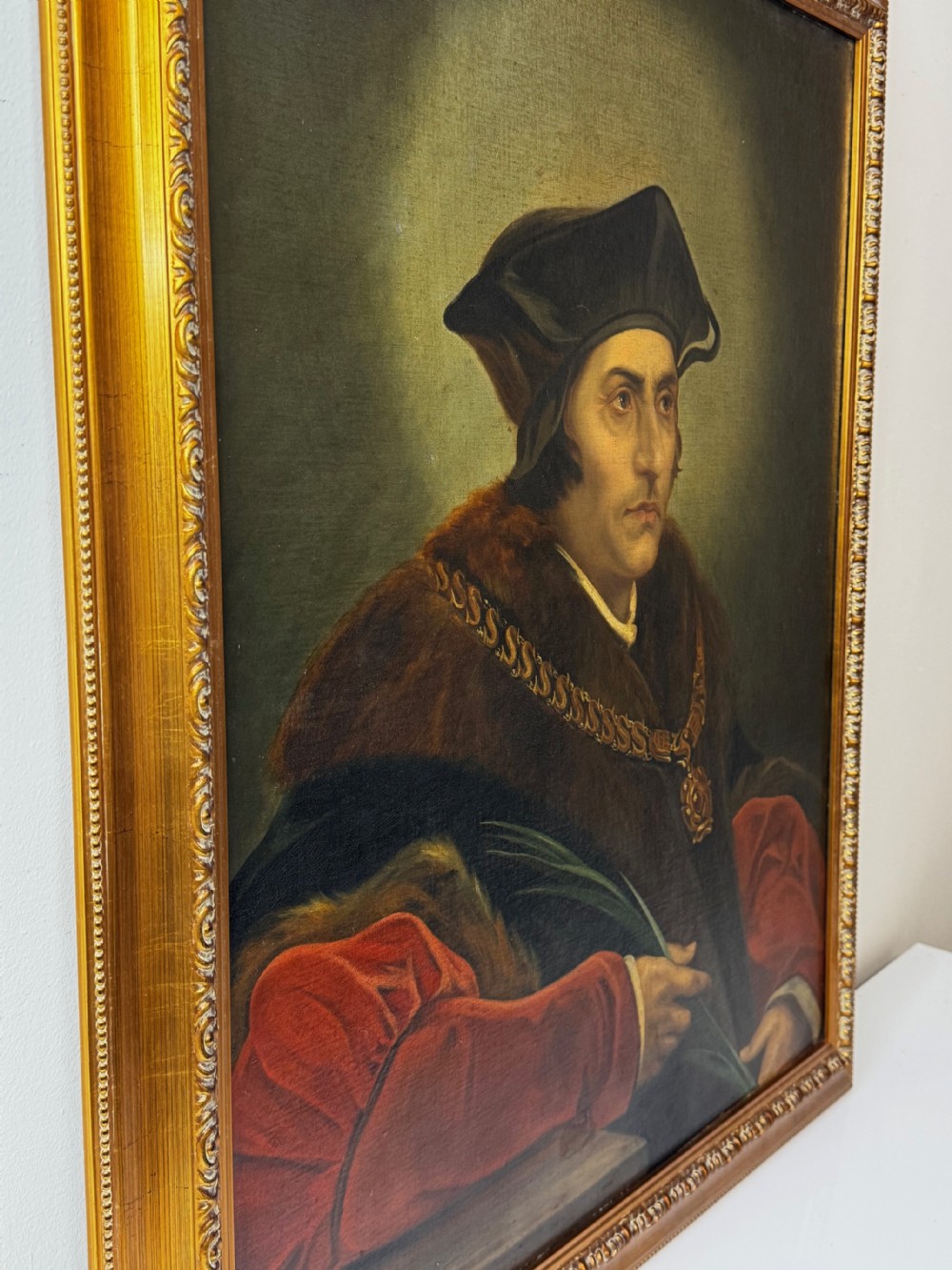 An oil portrait painting depicting Sir Thomas More framed in an ornate gold gilt wood frame. View VI