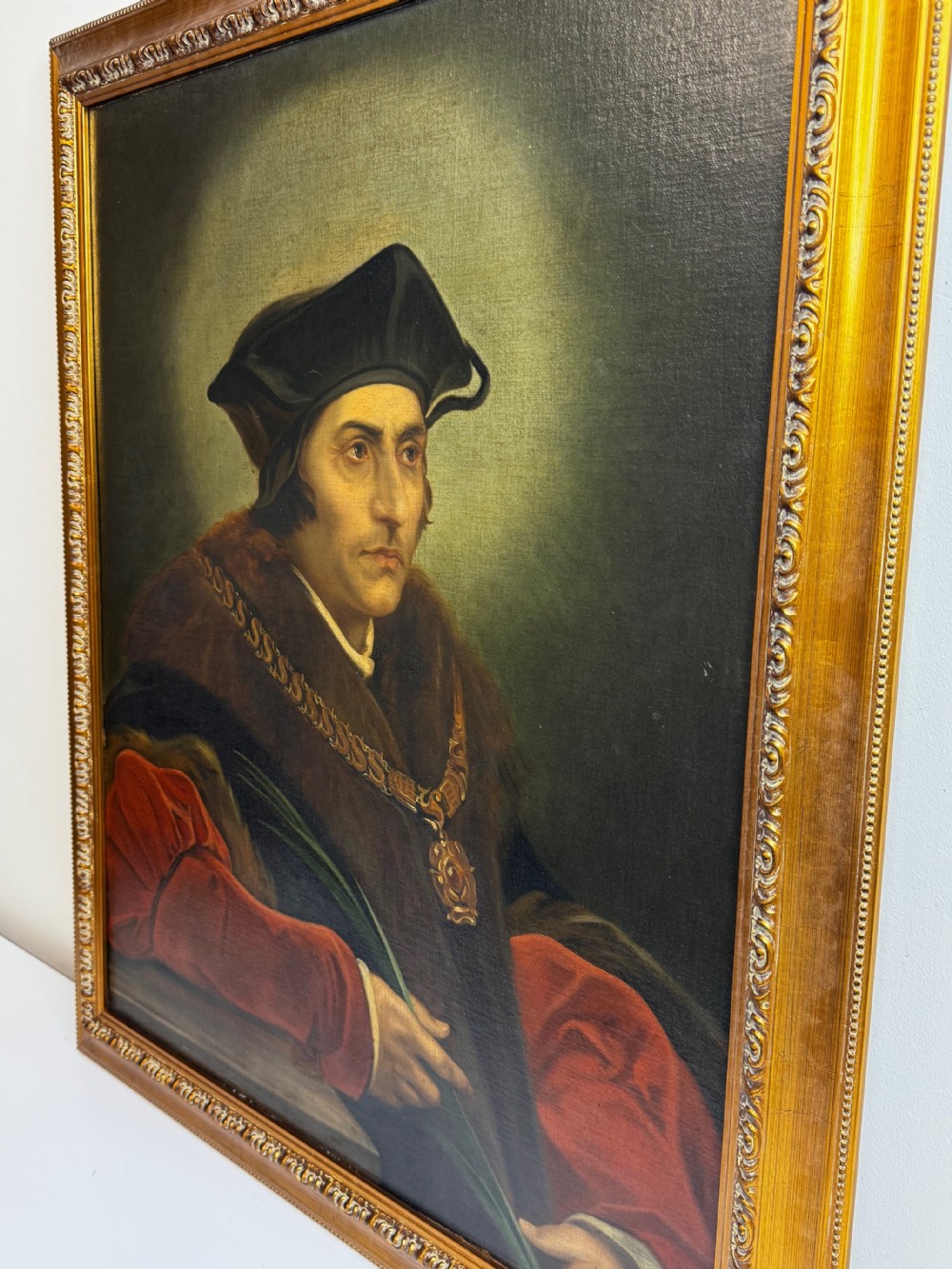 An oil portrait painting depicting Sir Thomas More framed in an ornate gold gilt wood frame. View IX