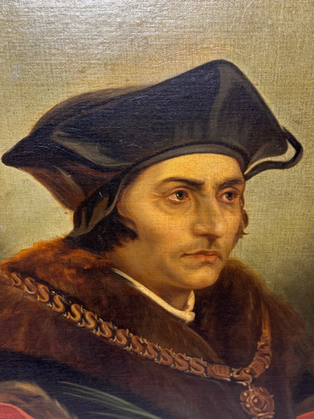 An oil portrait painting depicting Sir Thomas More framed in an ornate gold gilt wood frame. View XX