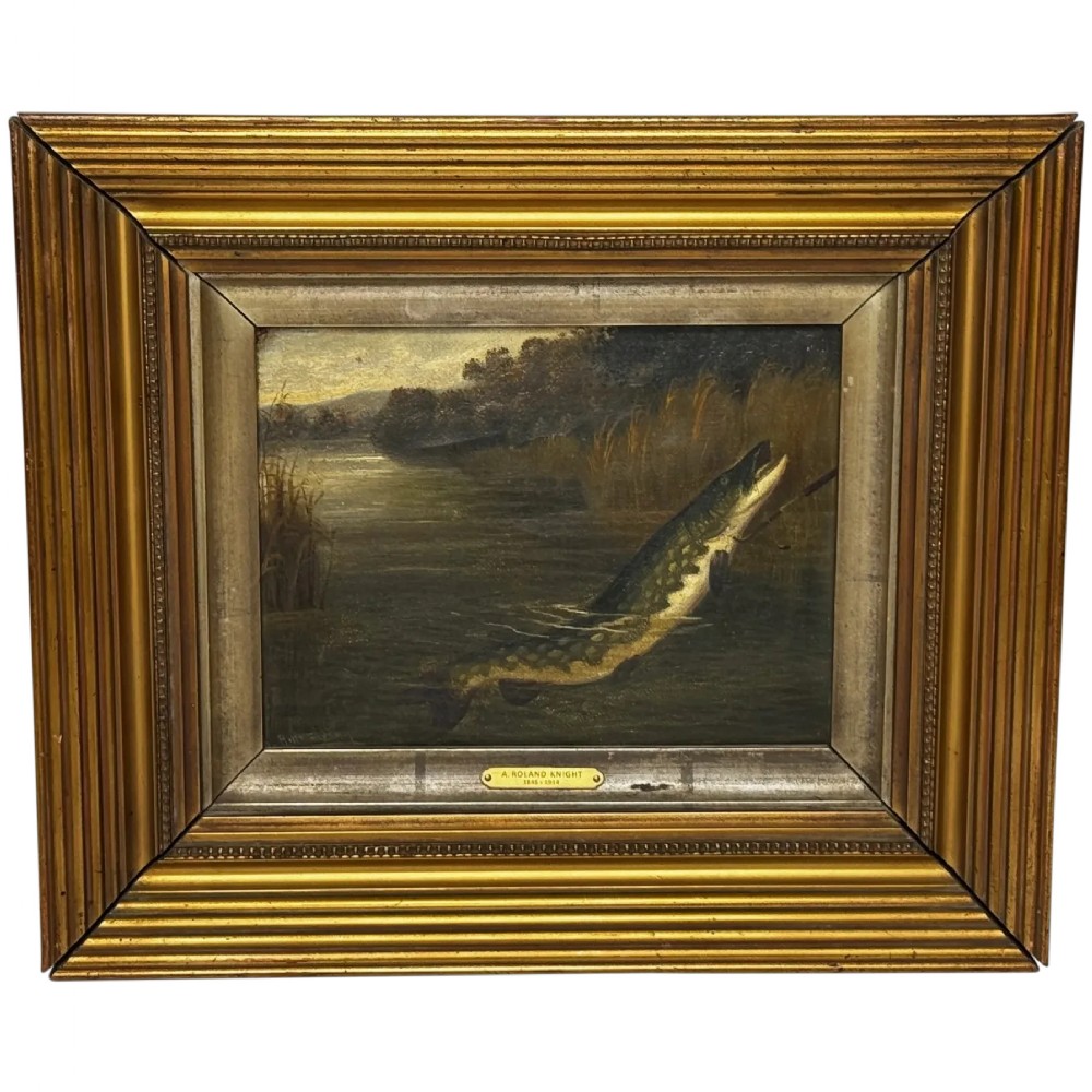An antique Victorian oil painting depicting a northern pike fish surfacing from a river, set within a gilded moulded frame.