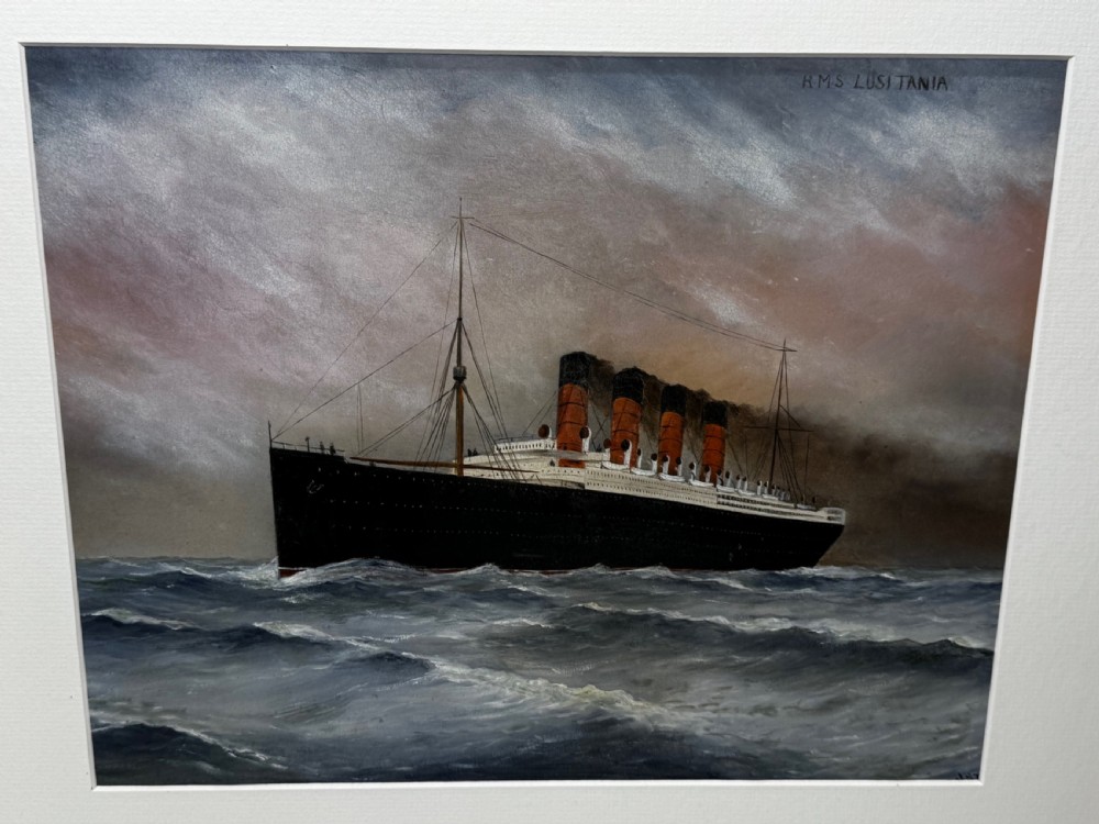 A framed marine painting depicting the RMS Lusitania ocean liner navigating choppy seas under a cloudy sky, enclosed within a textured gilt frame. View V