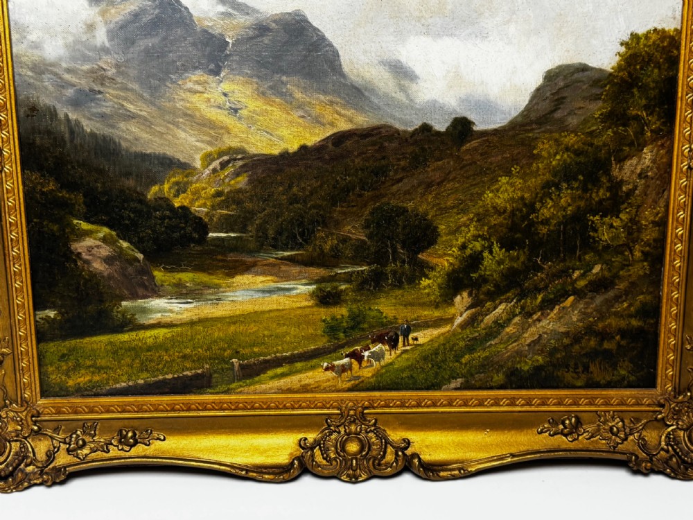 A Victorian landscape oil painting depicting the mountainous Borrowdale valley in the Lake District set within an ornate carved gold gilt frame. View V