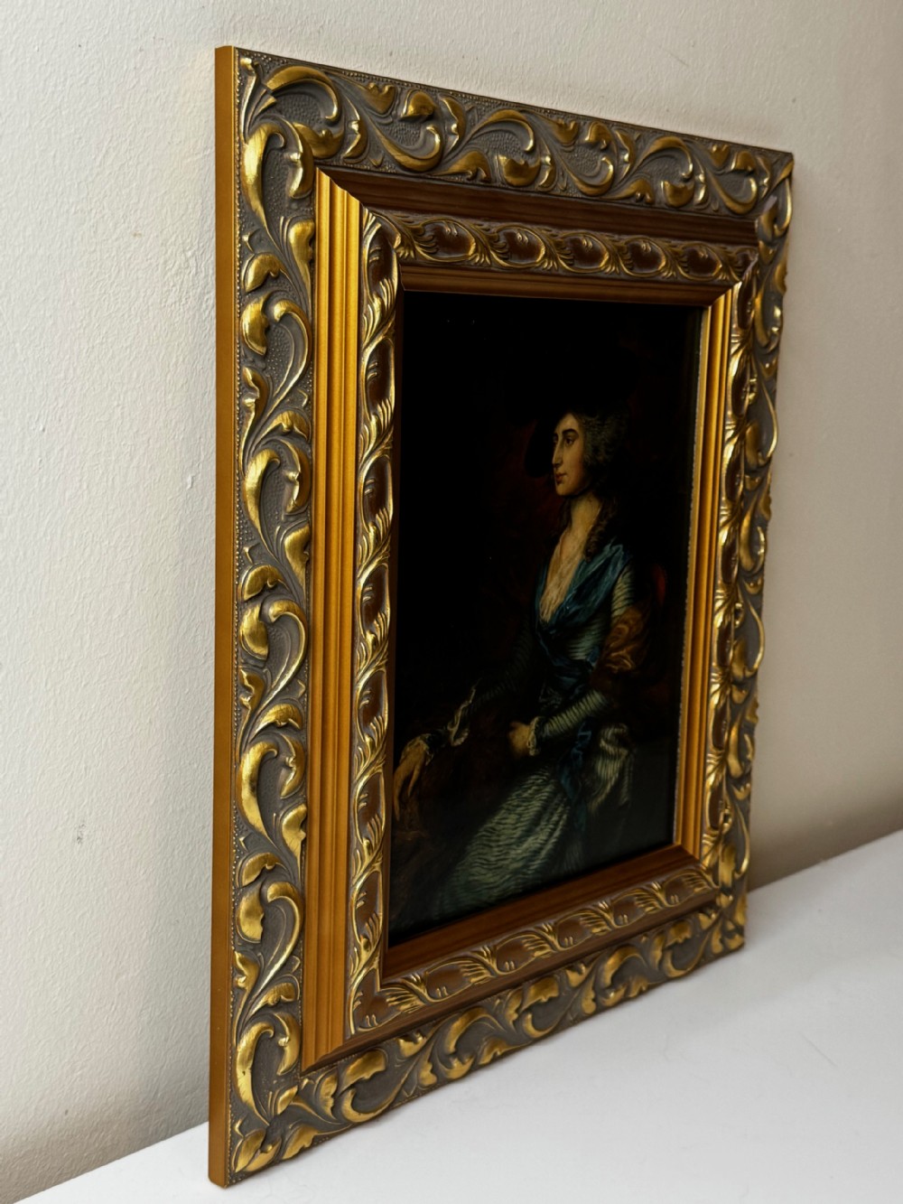 A framed 19th-century oil painting depicting Sarah Siddons in a blue gown and feathered hat, framed in ornate gilded moulding. View III