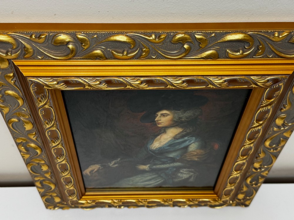 A framed 19th-century oil painting depicting Sarah Siddons in a blue gown and feathered hat, framed in ornate gilded moulding. View V