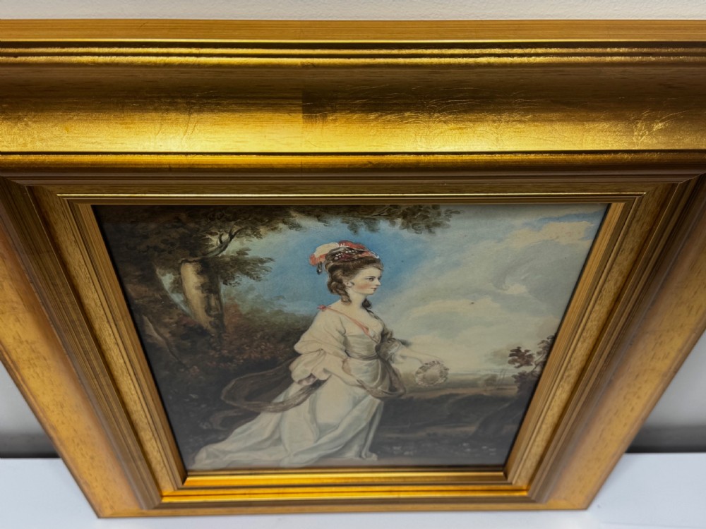 An eighteenth-century style portrait painting of a noblewoman in classical drapery holding a flower garland, displayed inside a wide gilded wooden frame. View II