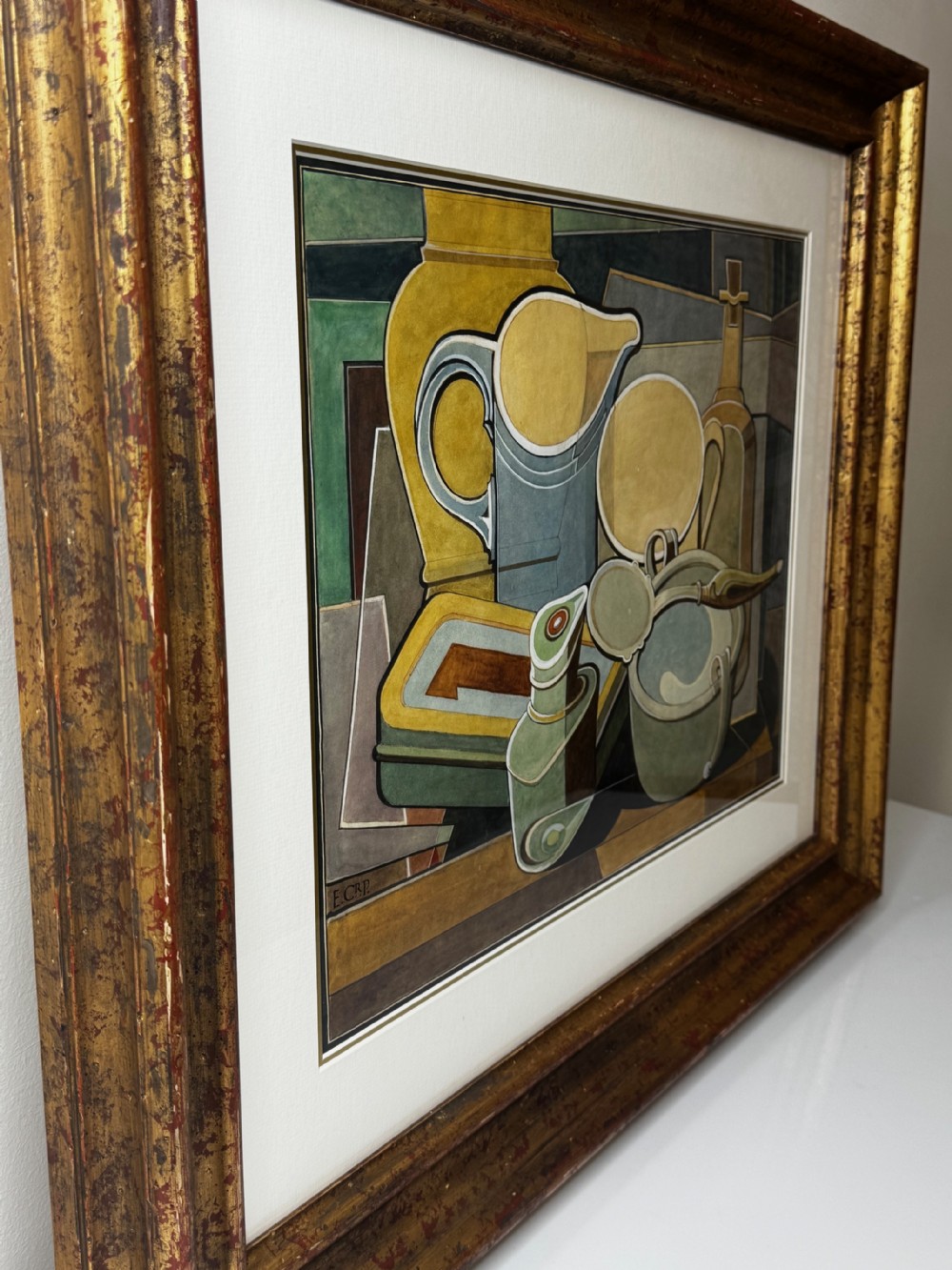 A framed Cubist watercolour still life featuring geometric kitchenware in shades of ochre, grey, and green within a distressed gilt frame. View X