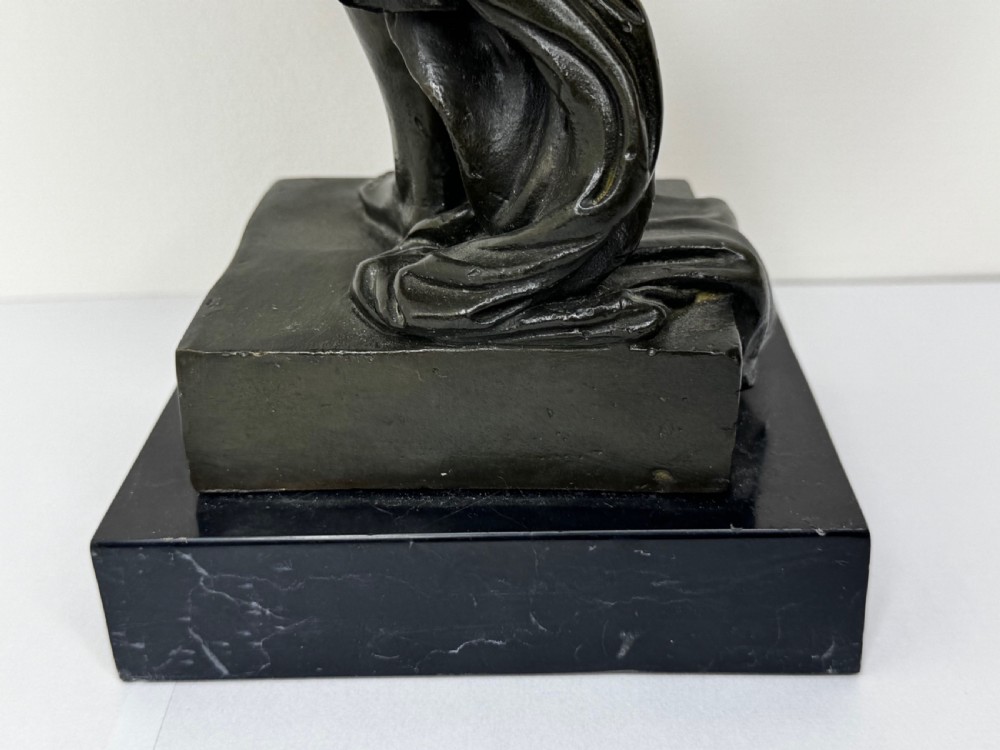 A French bronze sculpture depicting a standing allegorical female nude figure draped in fabric on a dark marble base. View XXIII