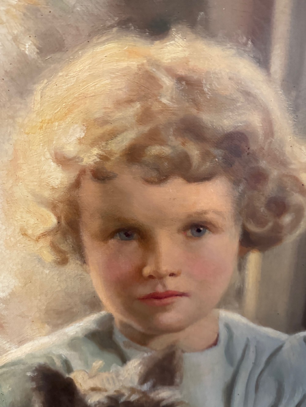 A mid-20th-century oil portrait depicting a young girl with blonde curly hair holding a Cairn Terrier. View III