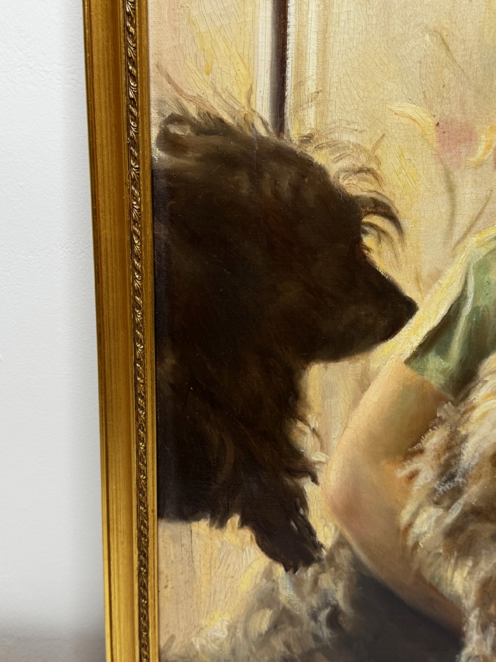 A mid-20th-century oil portrait depicting a young girl with blonde curly hair holding a Cairn Terrier. View XIII