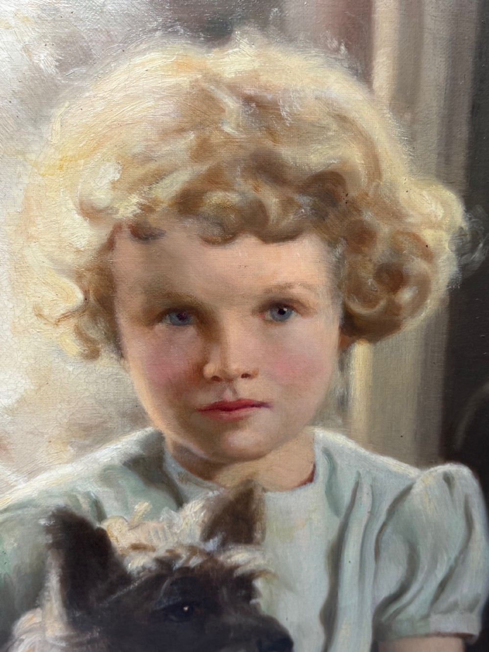 A mid-20th-century oil portrait depicting a young girl with blonde curly hair holding a Cairn Terrier. View XIX