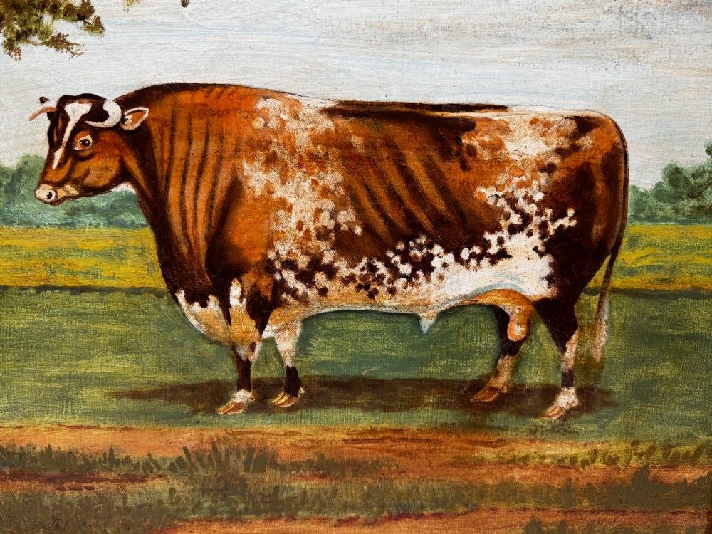 A 19th-century oil painting depicting a brown and white shorthorn bull standing in side profile in a green field, encased in a gilded frame. View VII