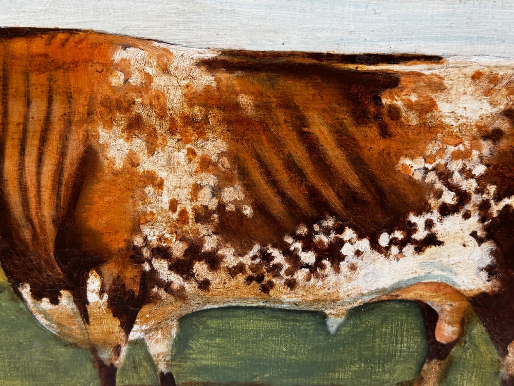 A 19th-century oil painting depicting a brown and white shorthorn bull standing in side profile in a green field, encased in a gilded frame. View XIII