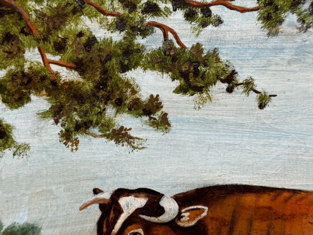 A 19th-century oil painting depicting a brown and white shorthorn bull standing in side profile in a green field, encased in a gilded frame. View XVIII