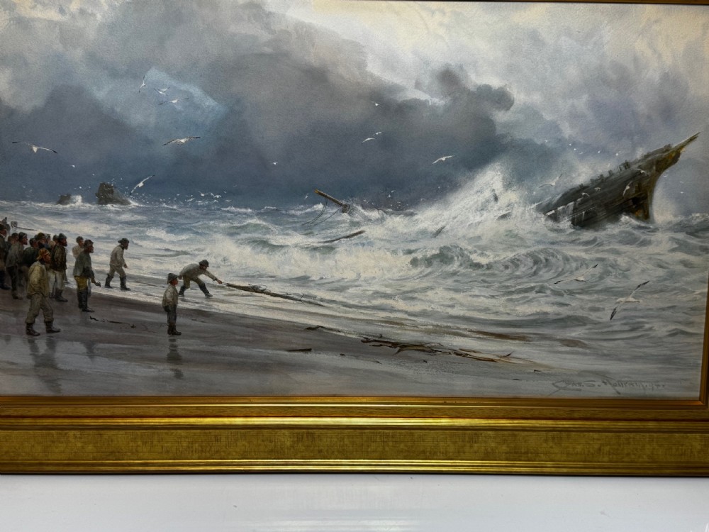 A 19th-century oil painting depicting figures on a shore watching a shipwreck in turbulent seas, set within a molded gilt frame. View II