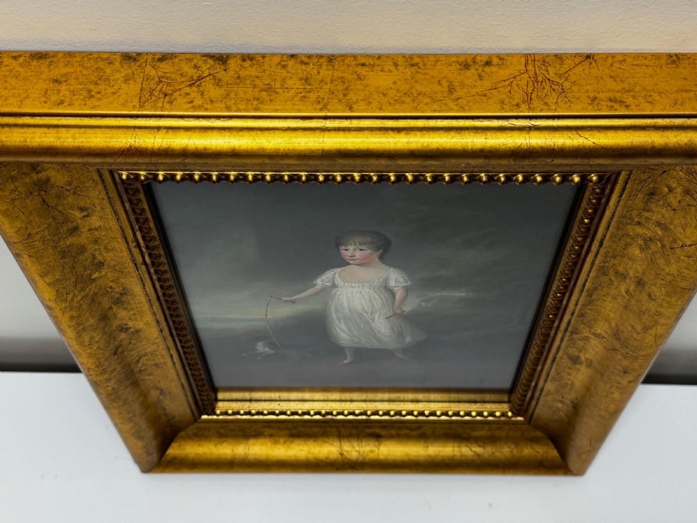 A Georgian oil painting depicted in an ornate gilded frame shows a young girl in a white dress holding a skipping rope alongside a dog in a rural landscape. View II