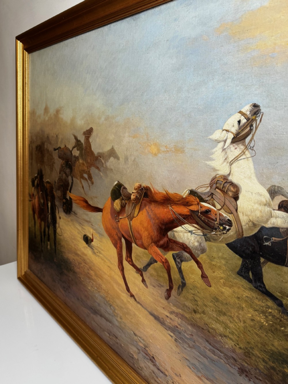 An antique framed oil painting on canvas depicting runaway horses across a dusty landscape, housed in a moulded gold gilt frame. View XIV