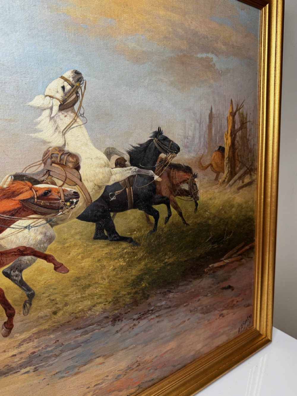 An antique framed oil painting on canvas depicting runaway horses across a dusty landscape, housed in a moulded gold gilt frame. View XVI