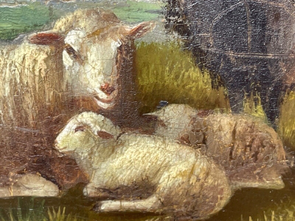 A pair of 19th-century oil paintings in ornate gilt frames depicting sheep, lambs, and goats resting in green pastoral landscapes. View VIII