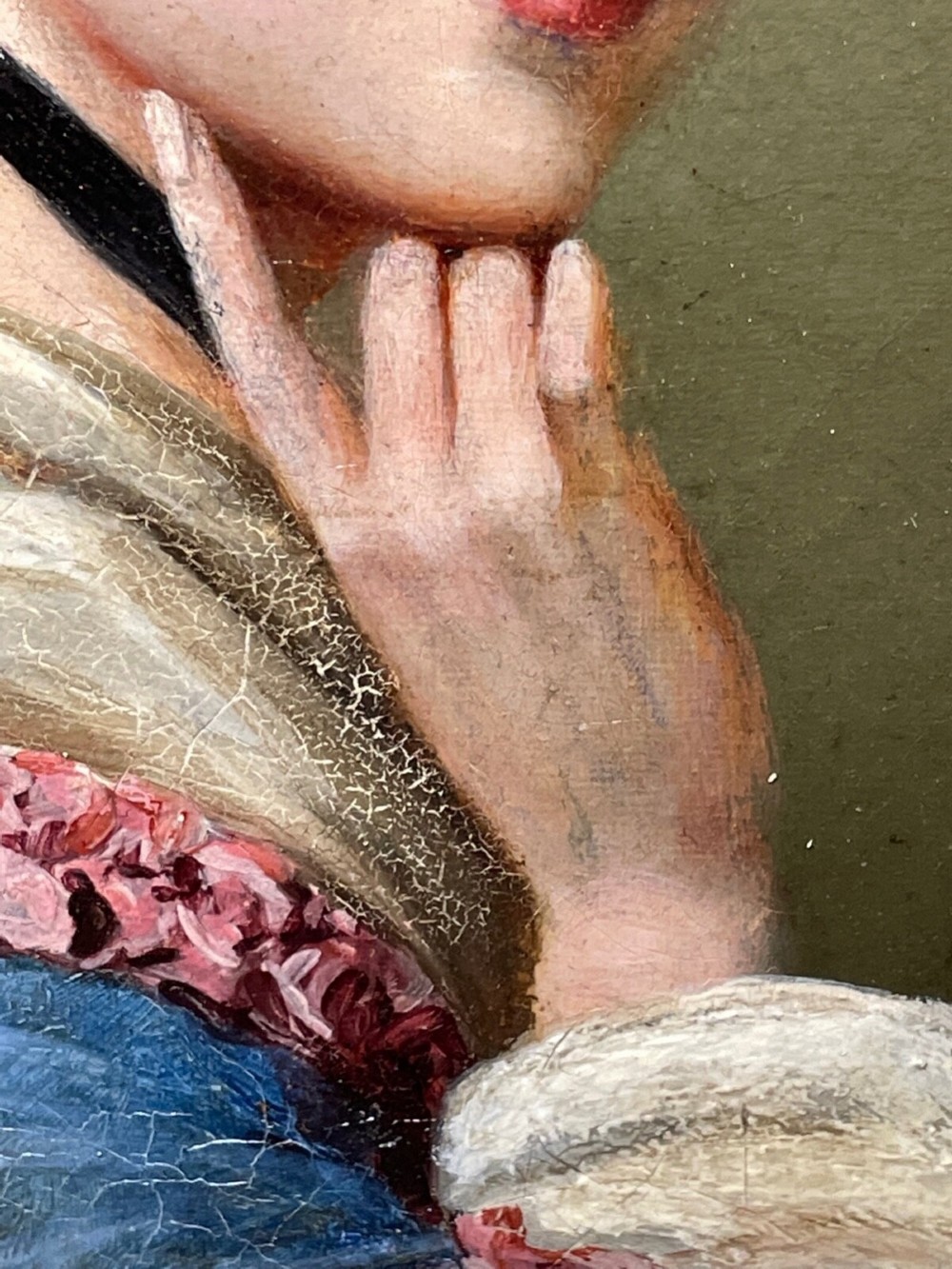 A Victorian oil portrait depicting a young woman with a flower in her hair wearing a blue dress, set within an ornate gilt frame. View II