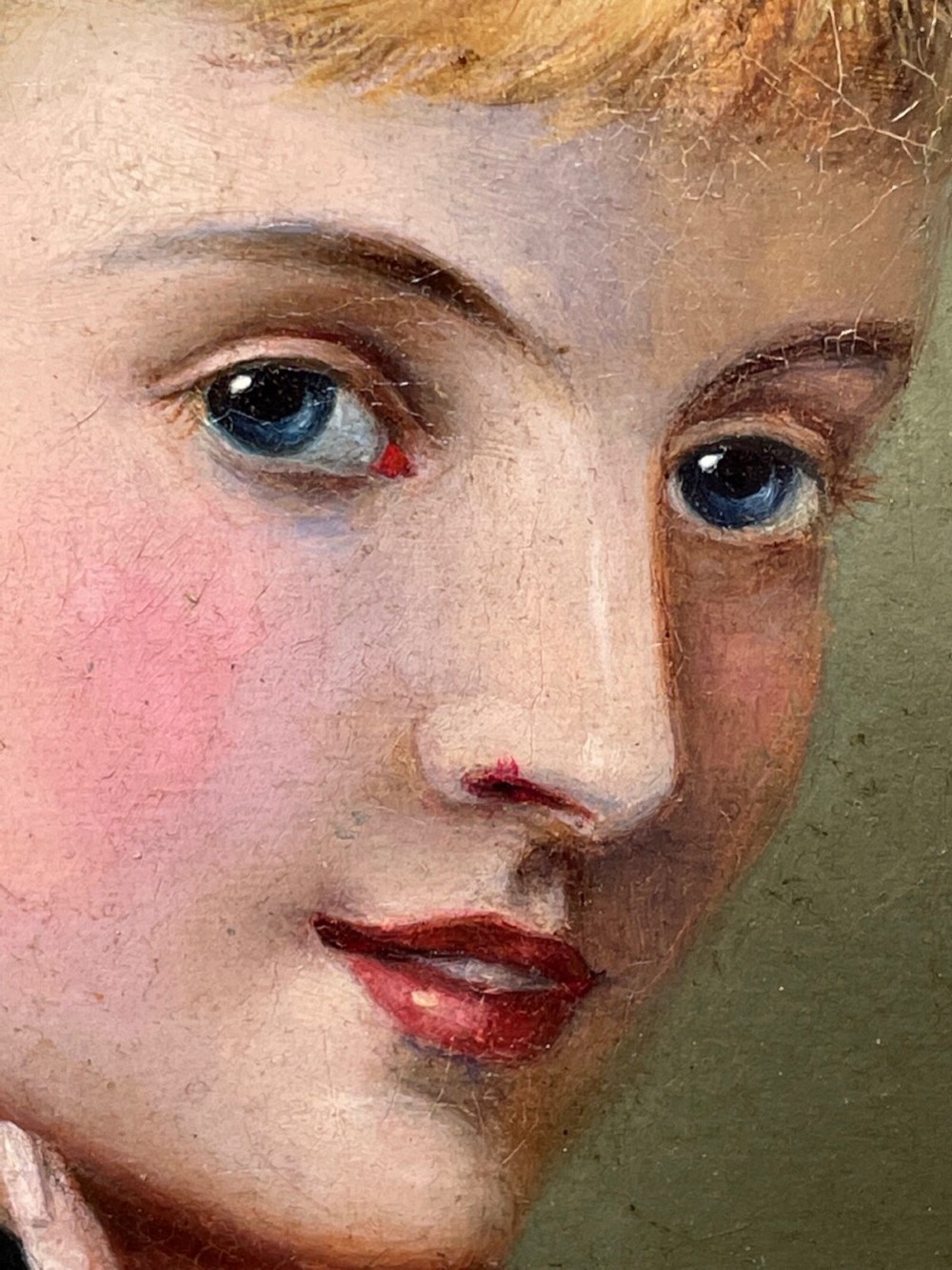 A Victorian oil portrait depicting a young woman with a flower in her hair wearing a blue dress, set within an ornate gilt frame. View XI