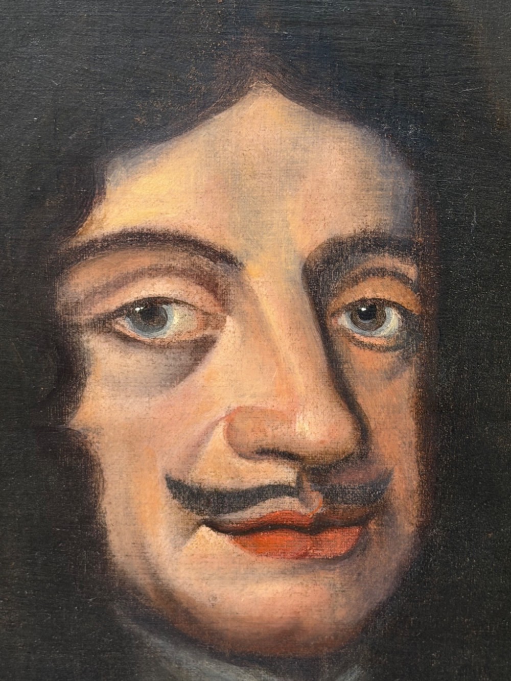 A 19th-century framed oil portrait depicting King Charles II wearing armour, a white lace cravat, and the Order of the Garter medallion against a dark background. View III
