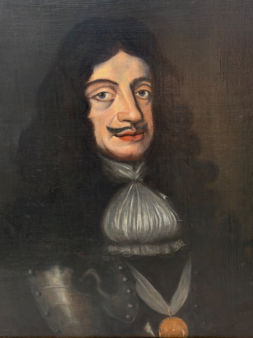 A 19th-century framed oil portrait depicting King Charles II wearing armour, a white lace cravat, and the Order of the Garter medallion against a dark background. View VII