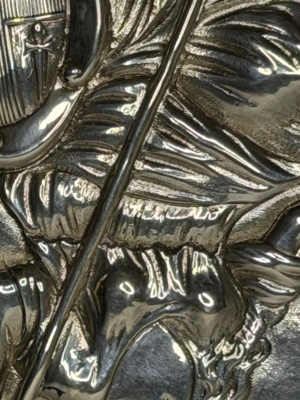 An oval George III sterling silver plaque featuring an embossed relief of Britannia holding a spear beside a shield and harp with embossed text reading London Assurance. View XIV