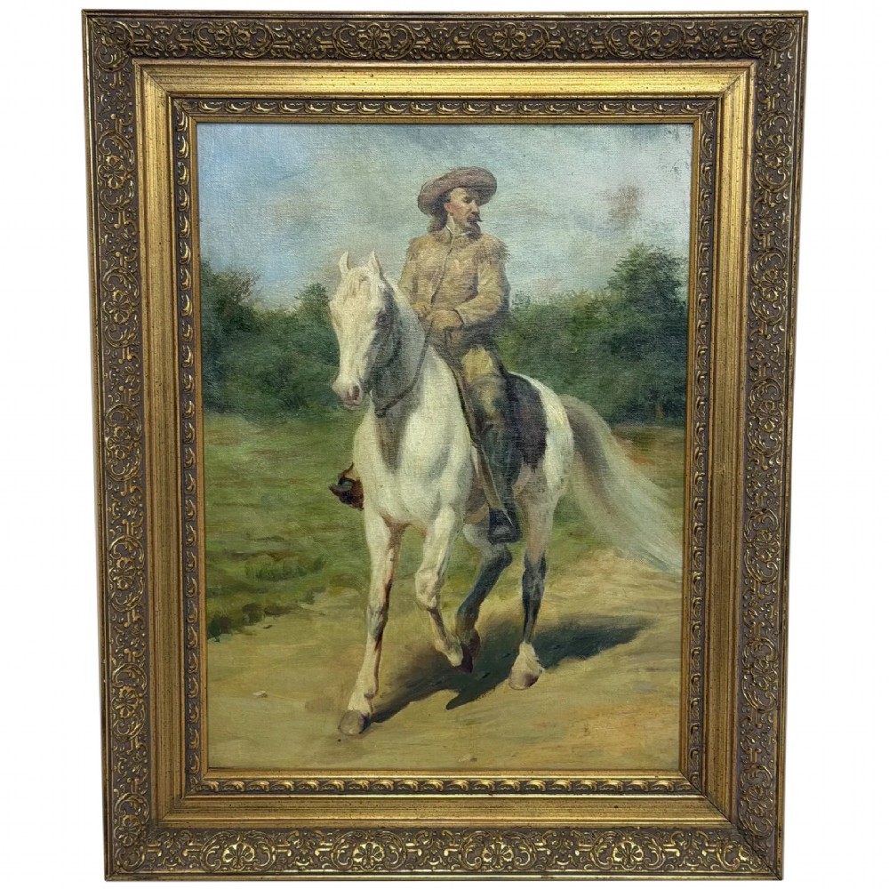 An oil painting depicting a man in a hat and buckskin jacket riding a grey horse along a rural path, set within an ornate gilded wooden frame.