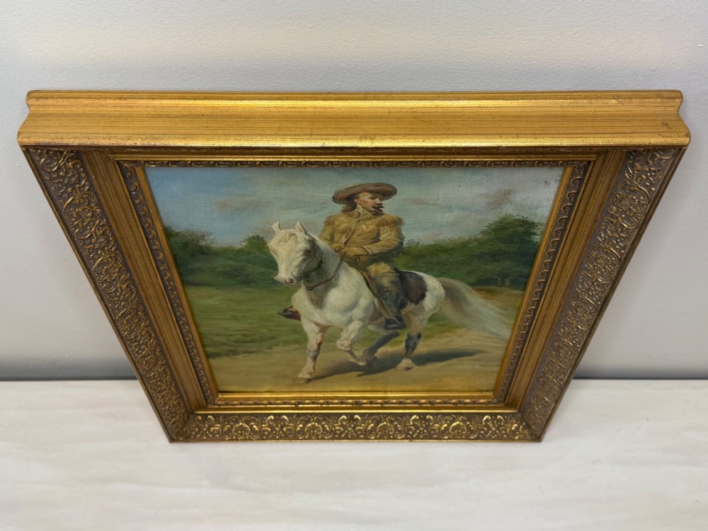 An oil painting depicting a man in a hat and buckskin jacket riding a grey horse along a rural path, set within an ornate gilded wooden frame. View VIII