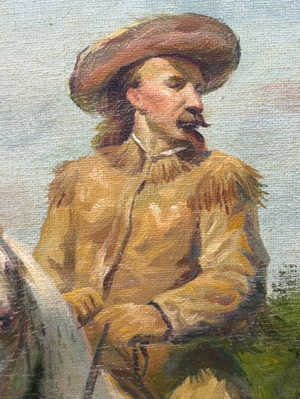 An oil painting depicting a man in a hat and buckskin jacket riding a grey horse along a rural path, set within an ornate gilded wooden frame. View IX
