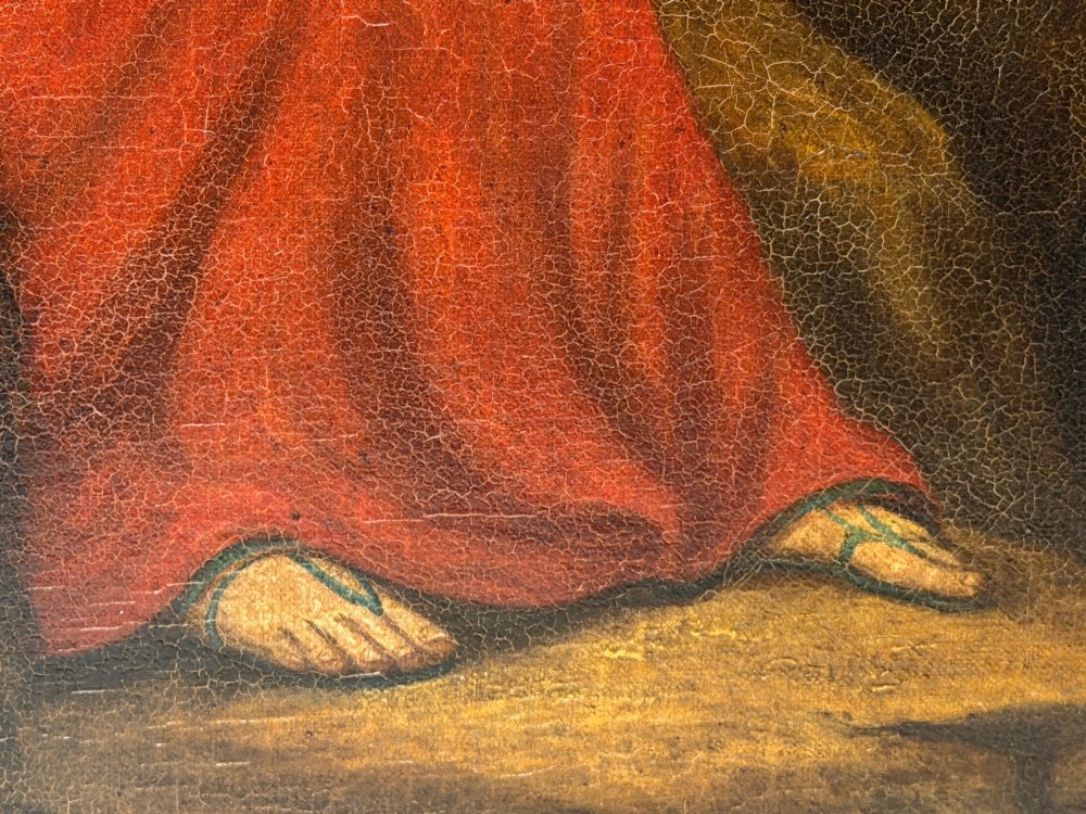 A framed Victorian oil painting depicting Daniel in a red robe seated inside a dark cavern surrounded by lions. View VII