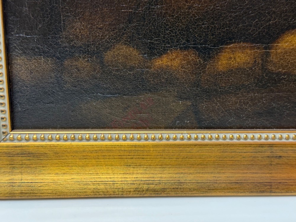 A framed Victorian oil painting depicting Daniel in a red robe seated inside a dark cavern surrounded by lions. View XII