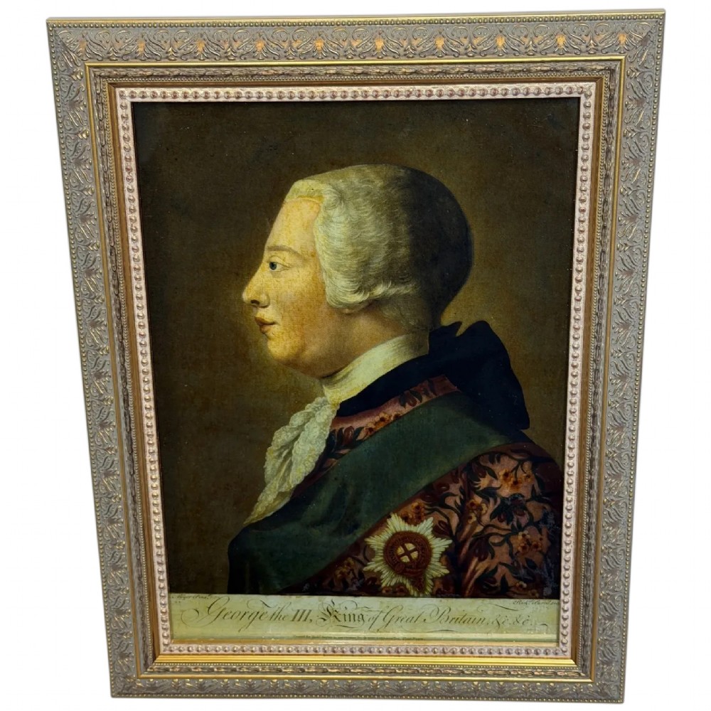 An 18th-century reverse glass mezzotint profile portrait of King George III housed within a decorative gilt frame.