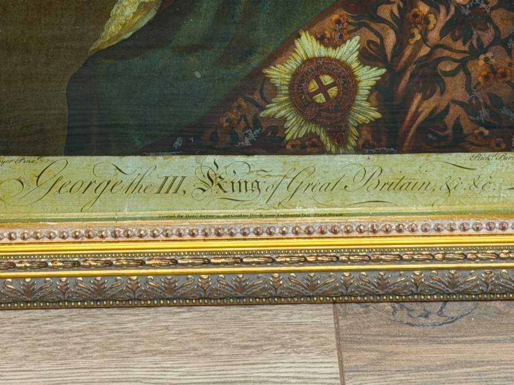 An 18th-century reverse glass mezzotint profile portrait of King George III housed within a decorative gilt frame. View V