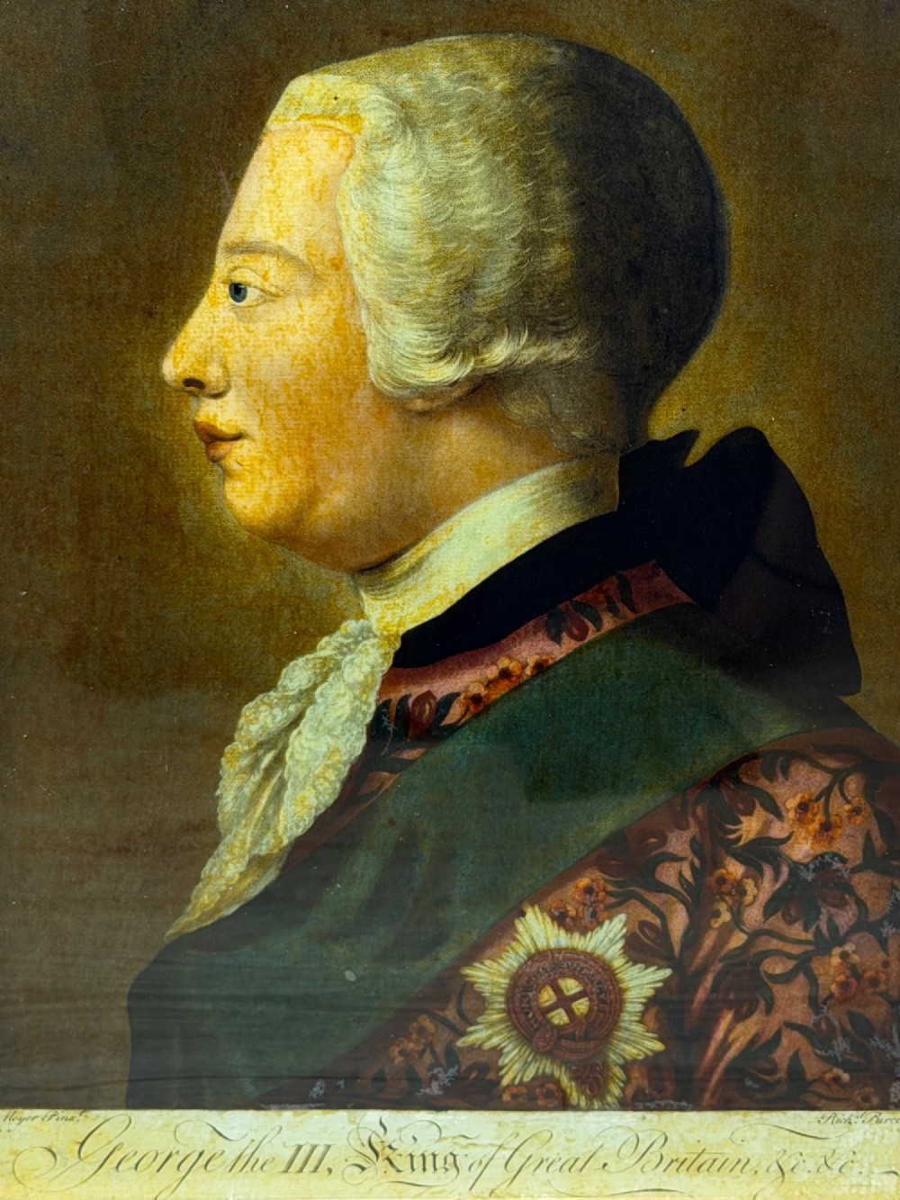 An 18th-century reverse glass mezzotint profile portrait of King George III housed within a decorative gilt frame. View IX