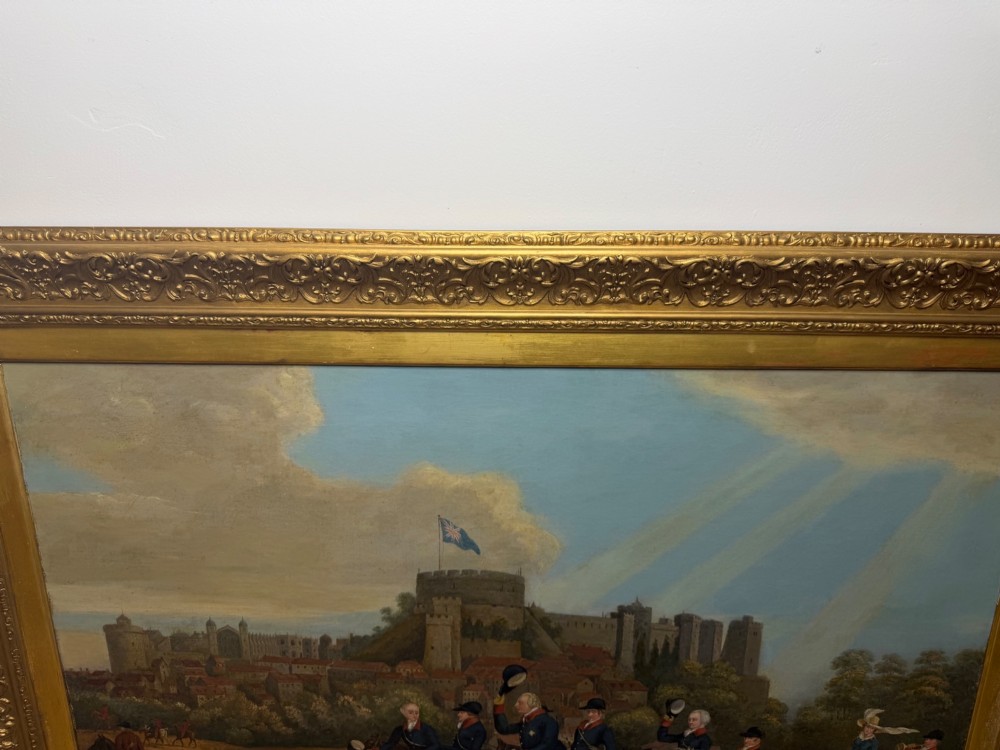 An antique oil painting on canvas depicting King George and hunters on horseback with hounds before Windsor Castle, housed in an ornate carved gilt frame. View VII