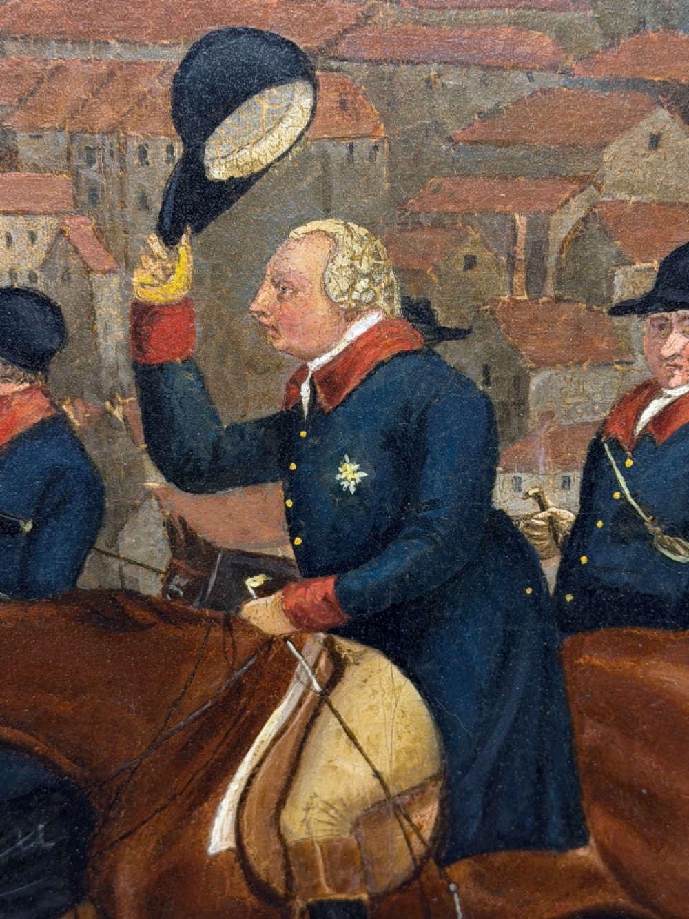 An antique oil painting on canvas depicting King George and hunters on horseback with hounds before Windsor Castle, housed in an ornate carved gilt frame. View X