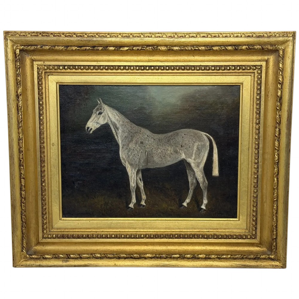 An antique oil painting depicting a standing grey mare in profile set within a heavy carved gold gilt frame.