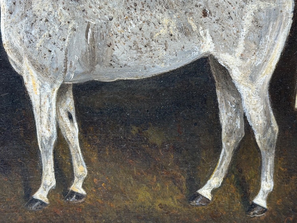 An antique oil painting depicting a standing grey mare in profile set within a heavy carved gold gilt frame. View IX