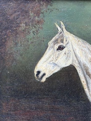 An antique oil painting depicting a standing grey mare in profile set within a heavy carved gold gilt frame. View VII